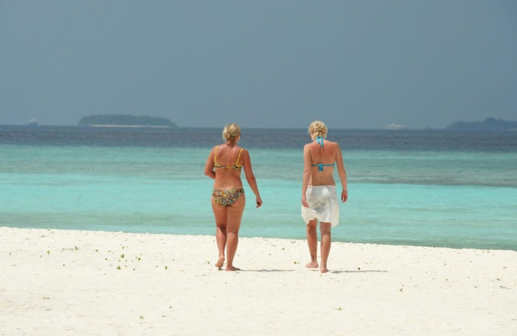 The Maldives has tightened entry requirements for tourists after a spike in coronavirus infections at more than a dozen resorts