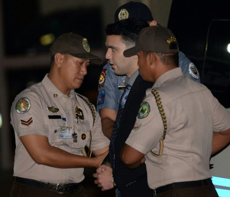 US Marine Lance Corporal Joseph Scott Pemberton is escorted by Philippines police at Camp Aguinaldo in Quezon City in December 2015