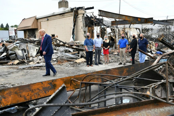 US President Donald Trump tours an area affected by civil unrest in Kenosha, Wisconsin on September 1, 2020