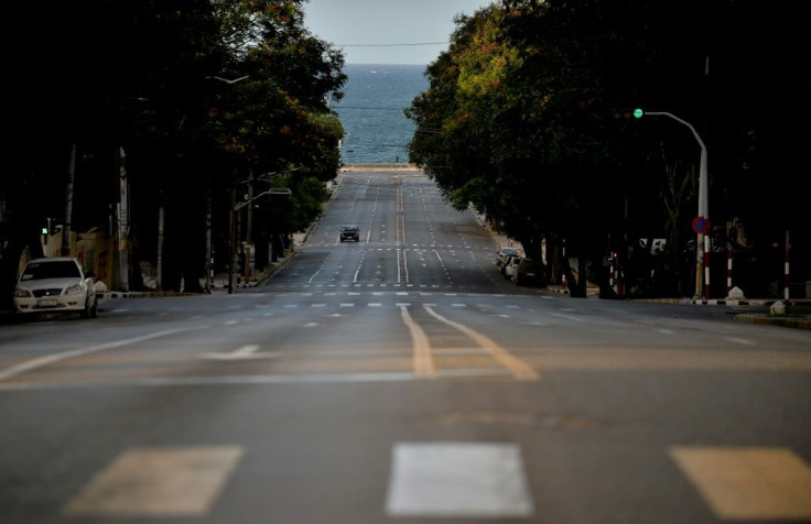 An avenue in the Cuban capital Havana is deserted as a dusk-to-dawn curfew takes hold