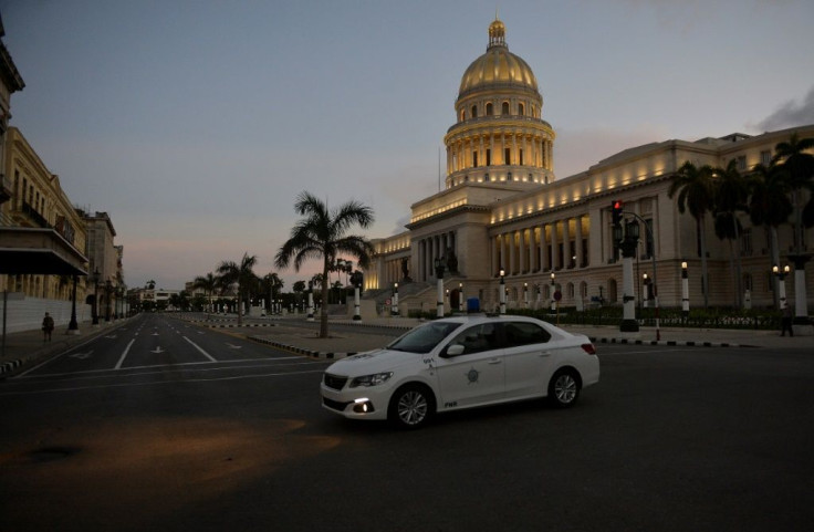 Cuban police patrol in central Havana after a curfew imposed to contain a resurgence of Covid-19 cases comes into force