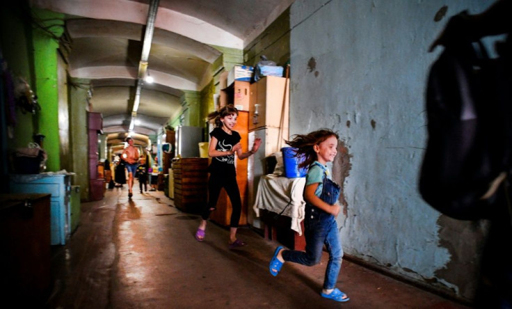 Children play in the long corridors to escape the crampness of their living quarters