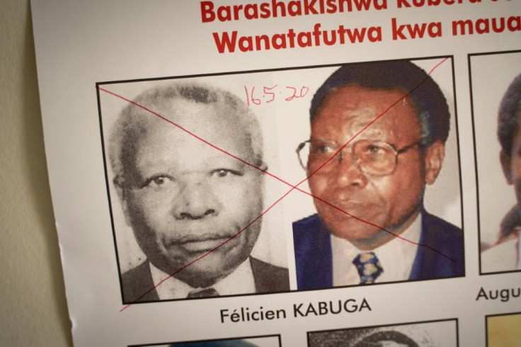 The date of arrest and a red cross are written on the face of Felicien Kabuga, one of the last key suspects in the 1994 Rwandan genocide, on a wanted poster at the Genocide Fugitive Tracking Unit office in Kigali