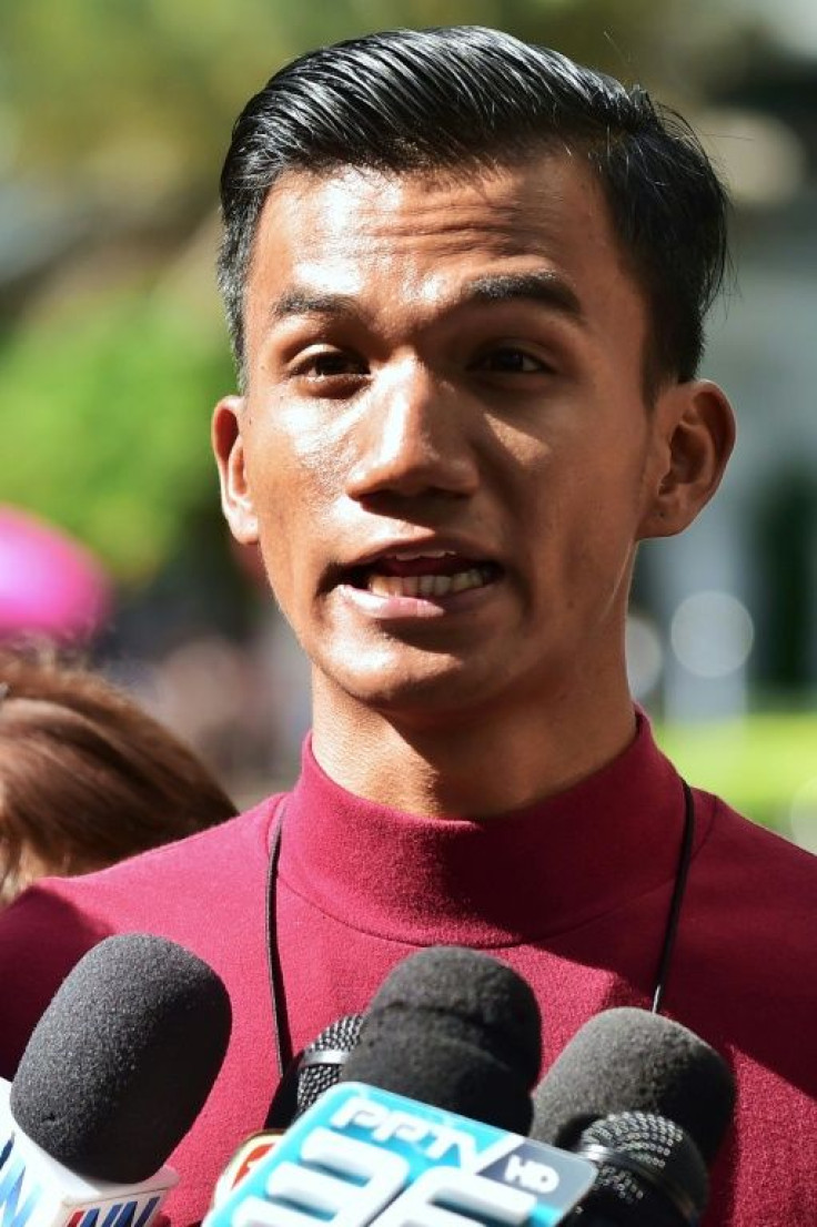 Activist Panupong "Mike" Jadnok speaks to the media as he arrives at the Criminal Court