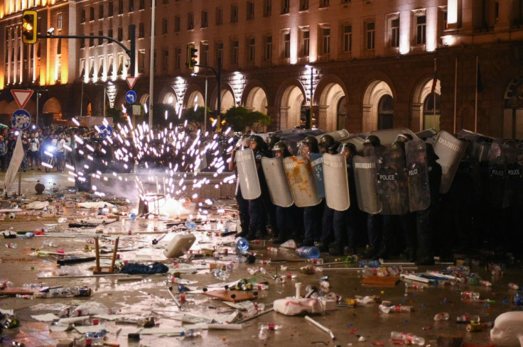 Protesters threw improvised explosives at the police in riot gear