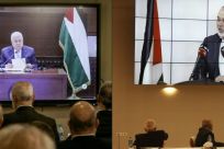 Palestinian factions gathered at their embassy in Beirut attend by video conference talks with president Mahmud Abbas (screen), while their counterparts in the West Bank watch speech of Hamas chief Ismail Haniyeh in Beirut