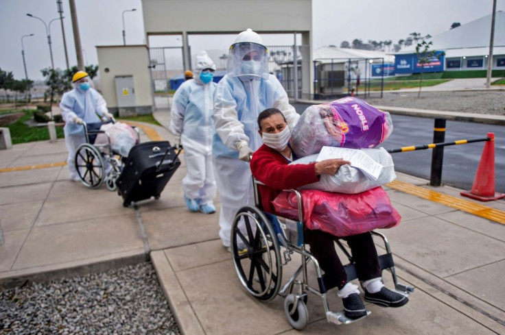 Health workers at the temporary hospital at Villa Panamericana celebrate each time a patient is discharged to go home