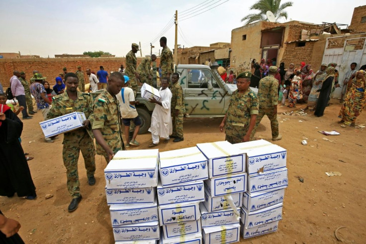 Sudanese security forces brought in food and aid for those forced from their homes by floods, as well as sand to help stop the rising waters