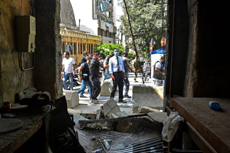 Lebanon's newly-named prime minister designate Mustapha Adib inspects the damage to homes and businesses in Gemmayzeh