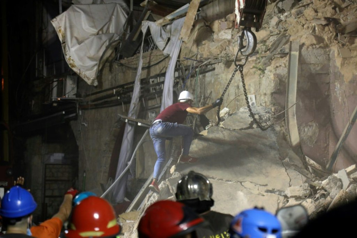 Rescuers scour the debris of a Beirut building brought down a month ago by a mega-blast after the heart beat of a possible survivor was detected