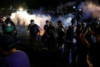 Police in the Wisconsin city of Kenosha used tear gas on August 25, 2020 in a bid to break up a demonstration sparked by the police shooting of Jacob Blake, a black man, as his three children watched