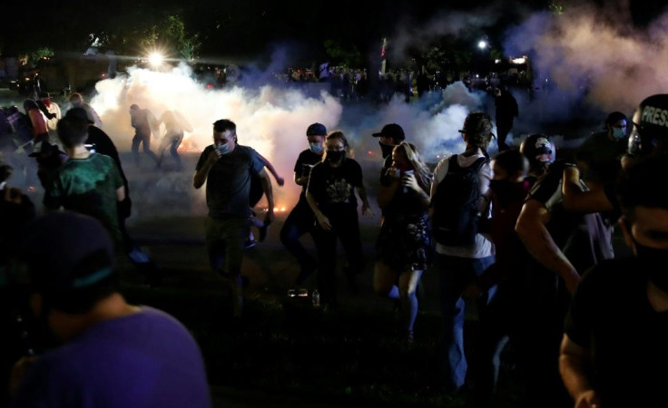 Police in the Wisconsin city of Kenosha used tear gas on August 25, 2020 in a bid to break up a demonstration sparked by the police shooting of Jacob Blake, a black man, as his three children watched