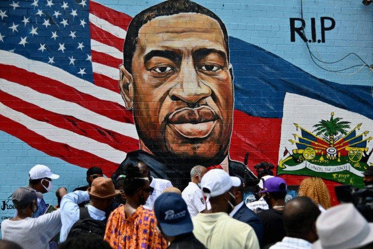 The face of George Floyd, who died under a policeman's knee in Minneapolis, is seen in a mural on the side of a supermarket in Brooklyn, New York
