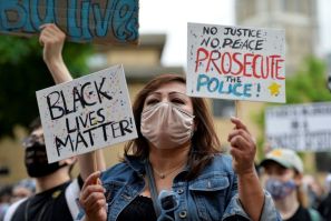 A demonstrator holding a 'Black Lives Matter' sign is seen taking part in an anti-racism protest in Boston, Massachusetts on May 29, 2020