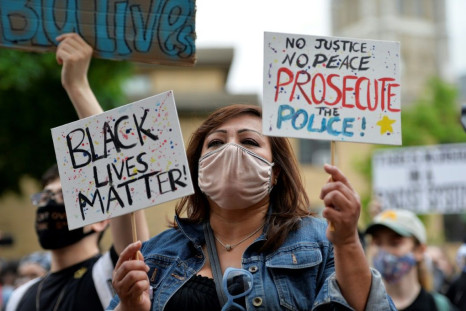 A demonstrator holding a 'Black Lives Matter' sign is seen taking part in an anti-racism protest in Boston, Massachusetts on May 29, 2020