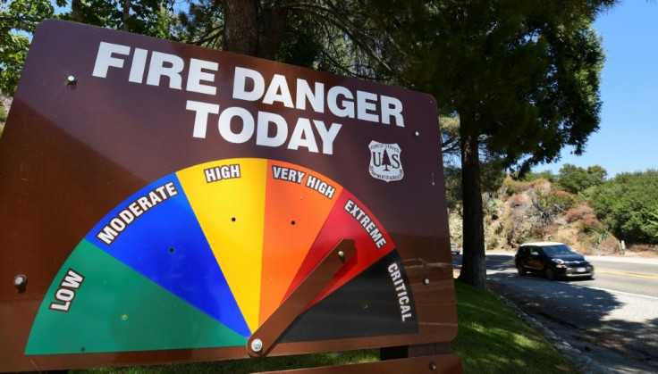 An arrow points toward Extreme Fire Danger on September 4, 2020 as a vehicle passes along the Angeles Crest Highway in the San Gabriel Mountains northeast of Los Angeles in La Canada Flintridge