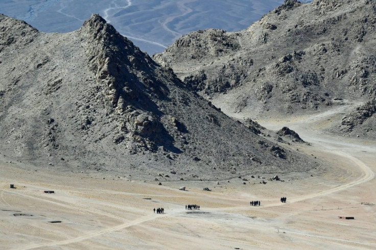 Indian soldiers walk in the foothills of a mountain range near Leh in Ladakh on June 23, 2020. Chinese and Indian troops have had a number of showdowns since a deadly clash on June 15