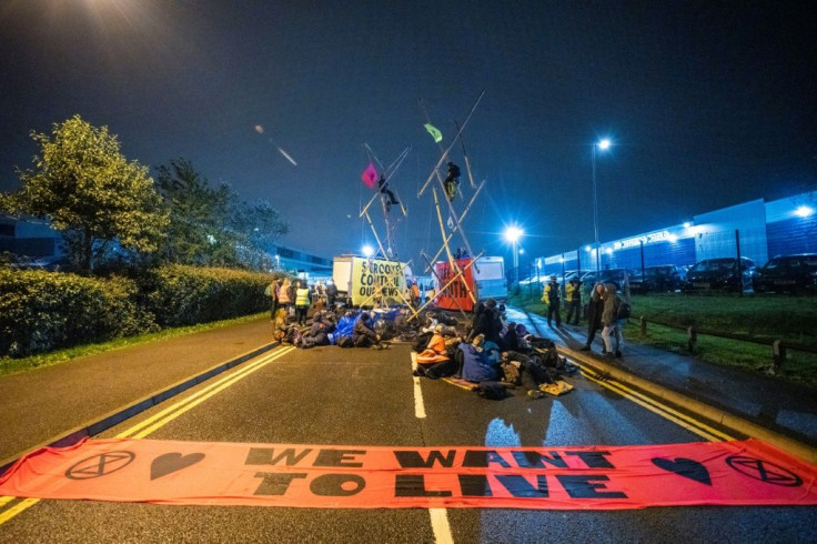 Extinction Rebellion activists disrupt newspaper distribution, claiming the big groups do not report fairly on climate changese the failure of these corporations to accurately report on climate change and what should be done to halt it