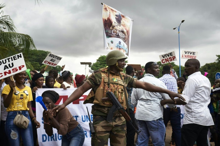 Supporters of the junta celebrate during a demonstration in Bamako at the start of talks