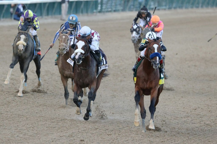 Authentic, ridden by jockey John Velazquez, powers down the stretch to win the 146th Kentucky Derby