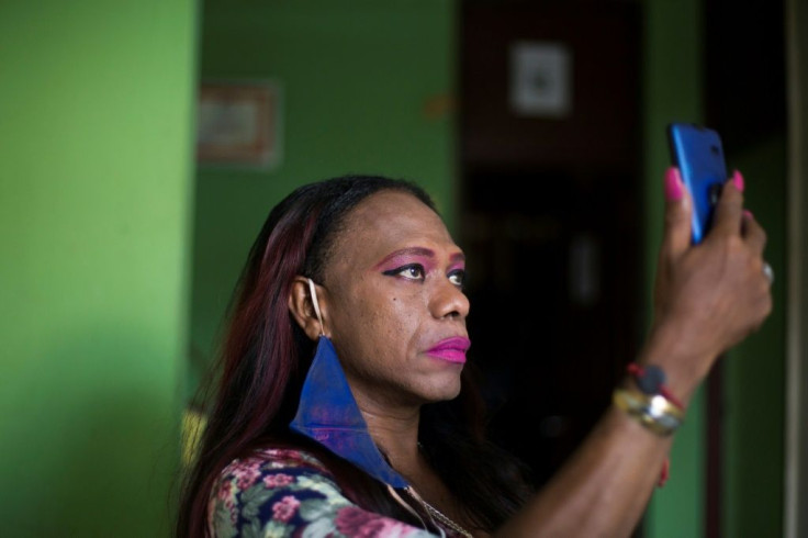 Transgender sex worker Luna Veras, 47, is seen in her apartment in Santo Domingo, Dominican Republic, on August 12, 2020; the pandemic has drastically reduced her income