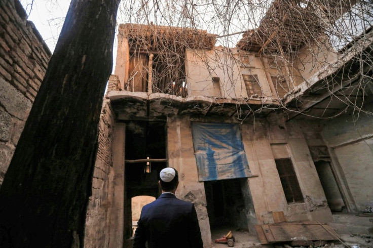 Ranj Abderrahman Cohen, an Iraqi Kurdish Jew, stands before a ruined synagogue in Arbil, capital of the autonomous Kurdish region of northern Iraq