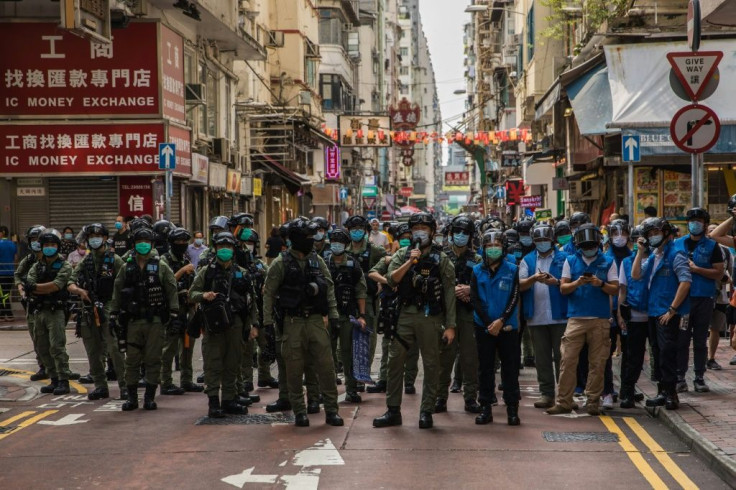 Police flooded Hong Kong's Kowloon district to stamp out protests on Sunday