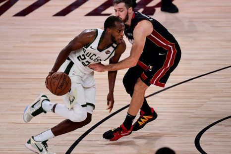 Milwaukee's Khris Middleton drives the to the basket in the Bucks' 118-115 overtime win over the Miami Heat in game four of their NBA playoff series
