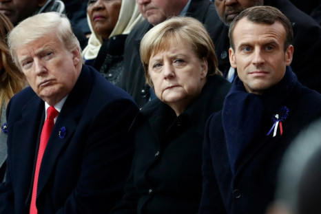 US President Donald Trump (L), German Chancellor Angela Merkel and French President Emmanuel Macron at a November 2018 ceremony in Paris for  the 100th anniversary of the end of World War I; Trump came home with art from the US ambassador's home