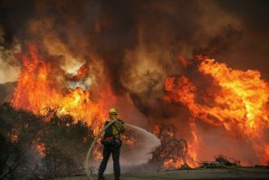 Firefighters battle the Valley Fire in Jamul, near San Diego, California. The Valley Fire has destoyed 10,000 acres and 11 structures far, Cal Fire San Diego said