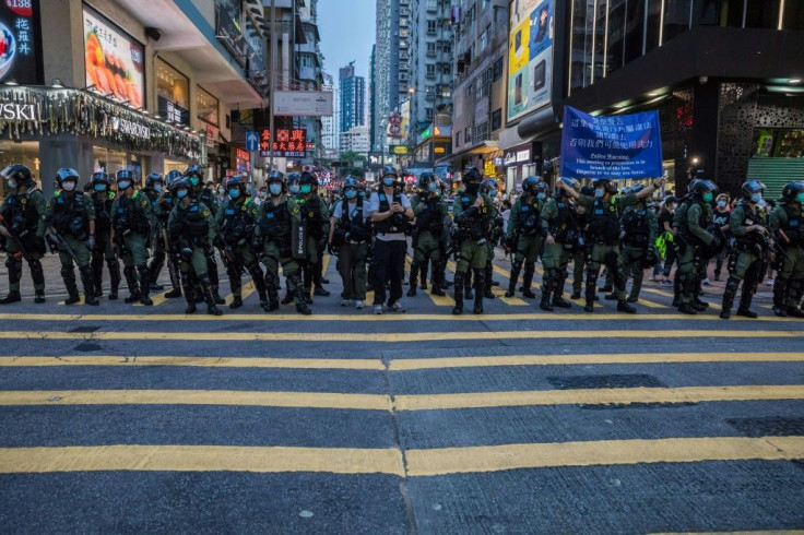 Police patrol after protesters rallied in Hong Kong to protest against the government's decision to postpone the legislative council elections