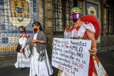 Supporters of Mexican President Andres Manuel Lopez Obrador hold a protest to call for his predecessors to face trial over corruption allegations