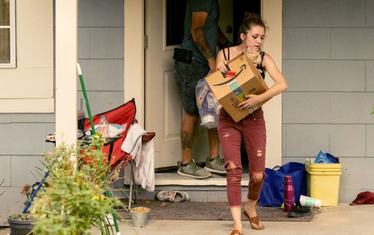 Residents evacuate with their pets during the Creek Fire in the North Fork area of unincorporated Madera County, California on September 7, 2020