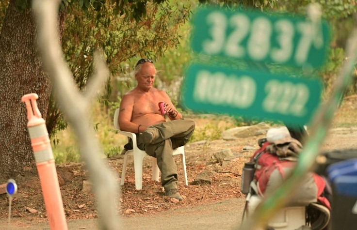 Evacuee Clay Brazil waits to be picked up during the Creek Fire in the North Fork area of unincorporated Madera County, California on September 7, 2020
