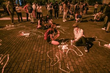 People light candles during a protest against violence and the recent massacres in the country, in Medellin, Colombia, on September 4, 2020