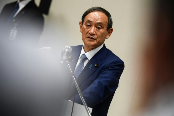 Yoshihide Suga, a top government enforcer, is seen as having an all-but-insurmountable lead in the race to become Japan's next prime minister