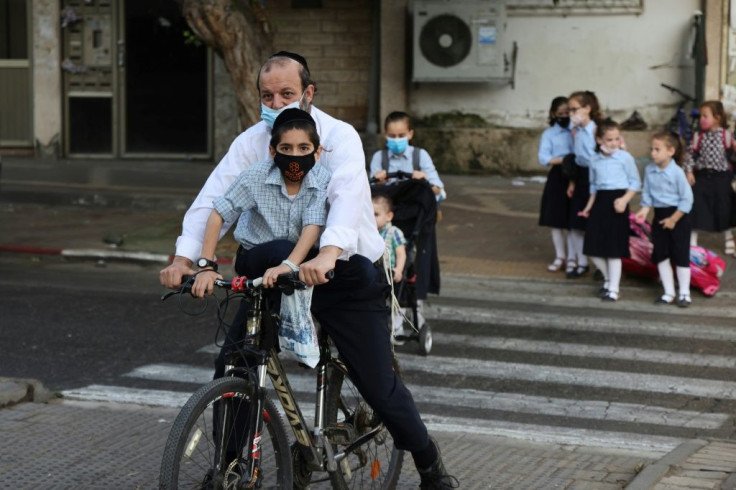 Israel has begun "a nightly closure" of 40 cities and towns with the highest infection rates