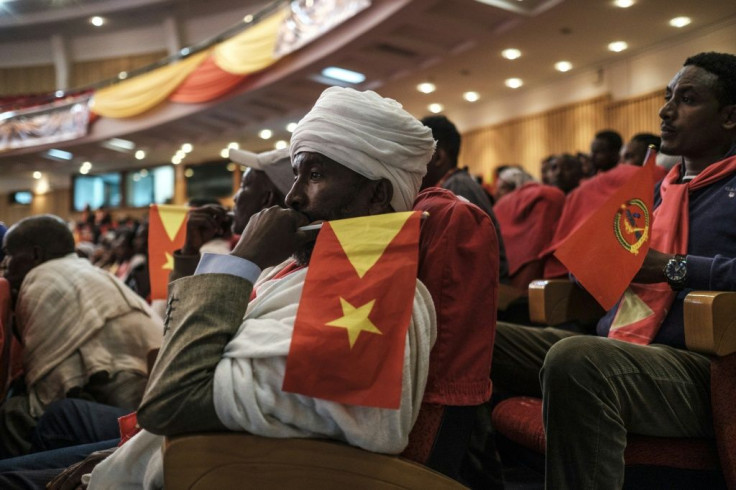 An Ethiopian Orthodox priest holds a Tigray flag during a Tigray People's Liberation Front (TPLF) congress in January