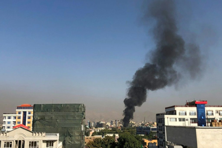 A smoke plume rises following an explosion targeting the convoy of Afghanistan's vice president Amrullah Saleh in Kabul
