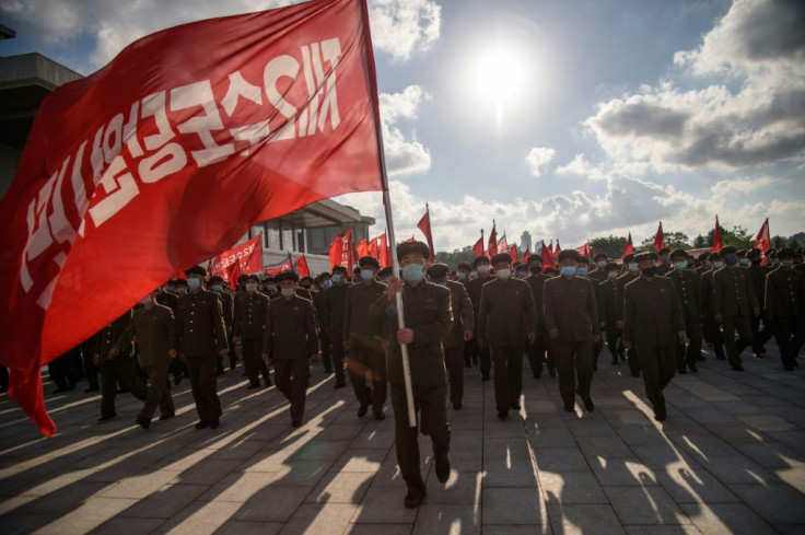 Members of a 12,000-strong volunteer workforce attend a rally to pledge support for a typhoon recovery campaign ordered by North Korea's leader Kim Jong Un at the Kumsusan palace in Pyongyang