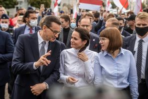 Exiled opposition leader Svetlana Tikhanovskaya walks with Polish Prime Minister Mateusz Morawiecki after telling Warsaw university students events in Belarus were 'historic'