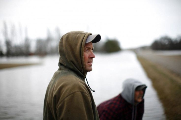 Volunteers build a levee to hold back floodwaters in rural North Dakota