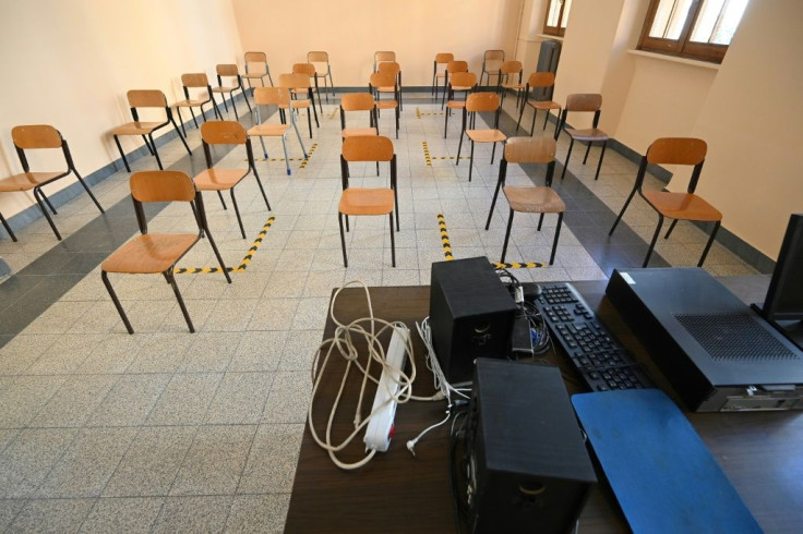 One metre apart: at Rome's Luigi Einaudi technical high school, staff have been setting up classrooms for pupils' return