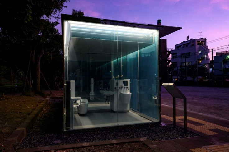 A new block of toilets in Tokyo features transparent walls that turn opaque when the user locks the door