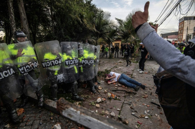 A protester lies injured in demonstrations over the death of Javier Ordonez, who was apparently tasered repeatedly by police