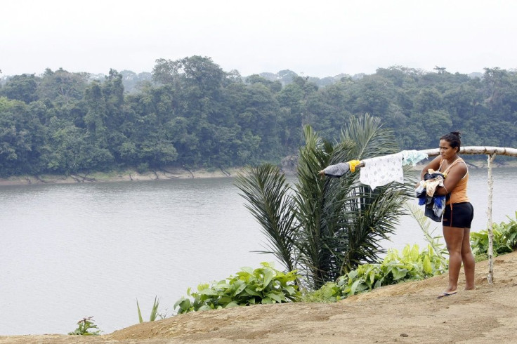 A women hangs clothes in the Juma Sustainable Development Reserve, deep in Brazil's Amazon, which lost 1,359 square kilometers (525 square miles) to deforestation in August 2020