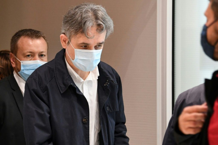 Charlie Hebdo's director Laurent Sourisseau walks out of the the Paris courthouse on September 9, 2020, during a hearing of the trial of 14 suspected accomplices the jihadist attacks on the French satirical weekly