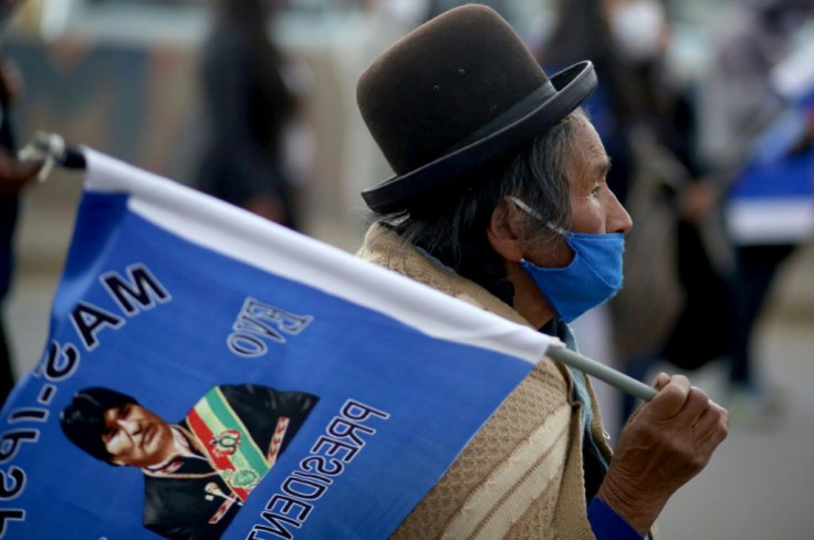 Evo Morales -- whose image is seen here on a supporter's flag during a campaign rally on September 9, 2020 in El Alto, Bolivia -- remains a hugely influential figure in the South American country