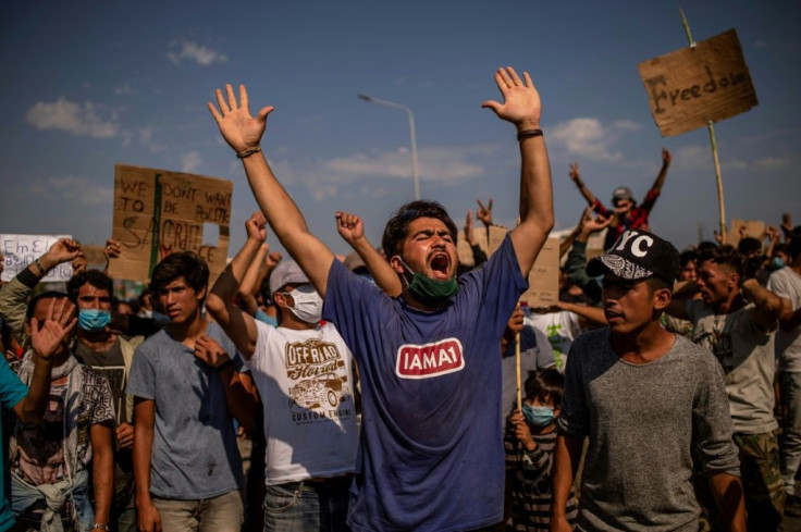 Clashes occurred near a new temporary camp built by Greek authorities where hundreds of migrants gathered to protest, some throwing stones at riot police who responded with tear gas.