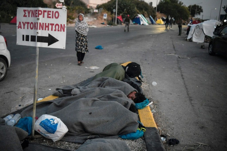 Hundreds of migrants are sleeping rough on a road near Mytilene on the Greek island of Lesbos